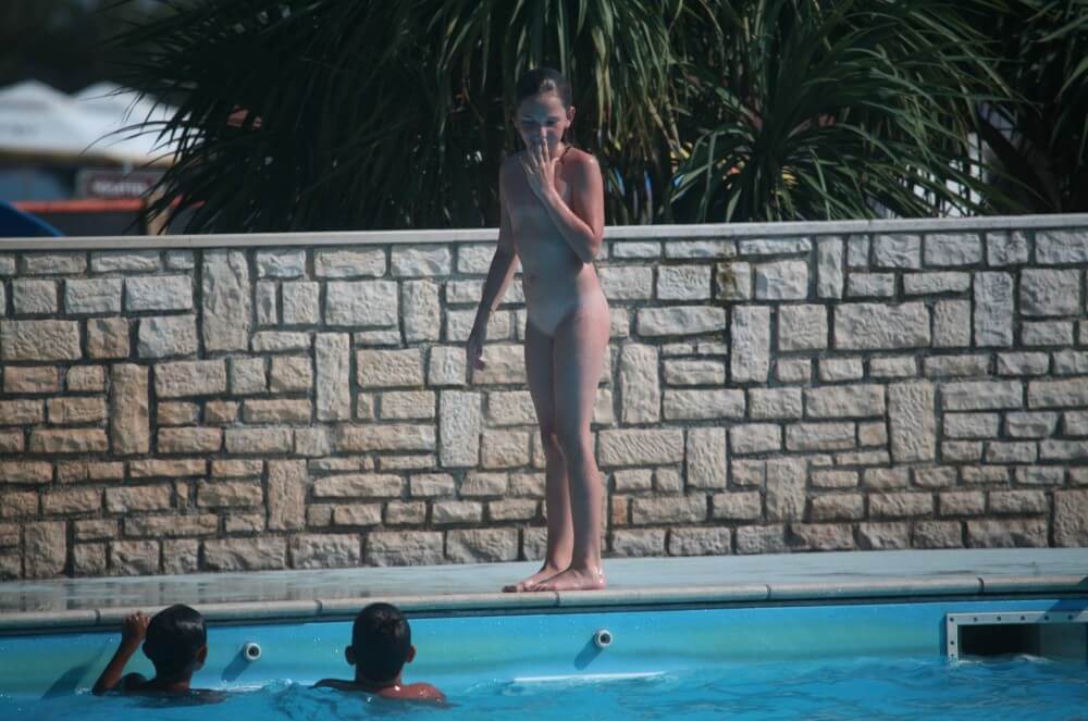 Naturist Pool-Side Singles photos - A nudist values inner balance and peace of mind
