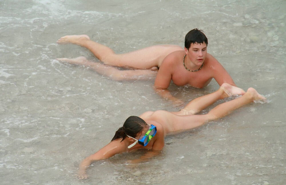 Wading In The Shallows pics - Nudists relax beautifully—a sight to behold
