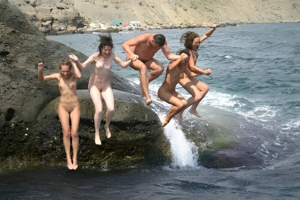 Mens and girls nudists on a beach - Nudism is based on human nature