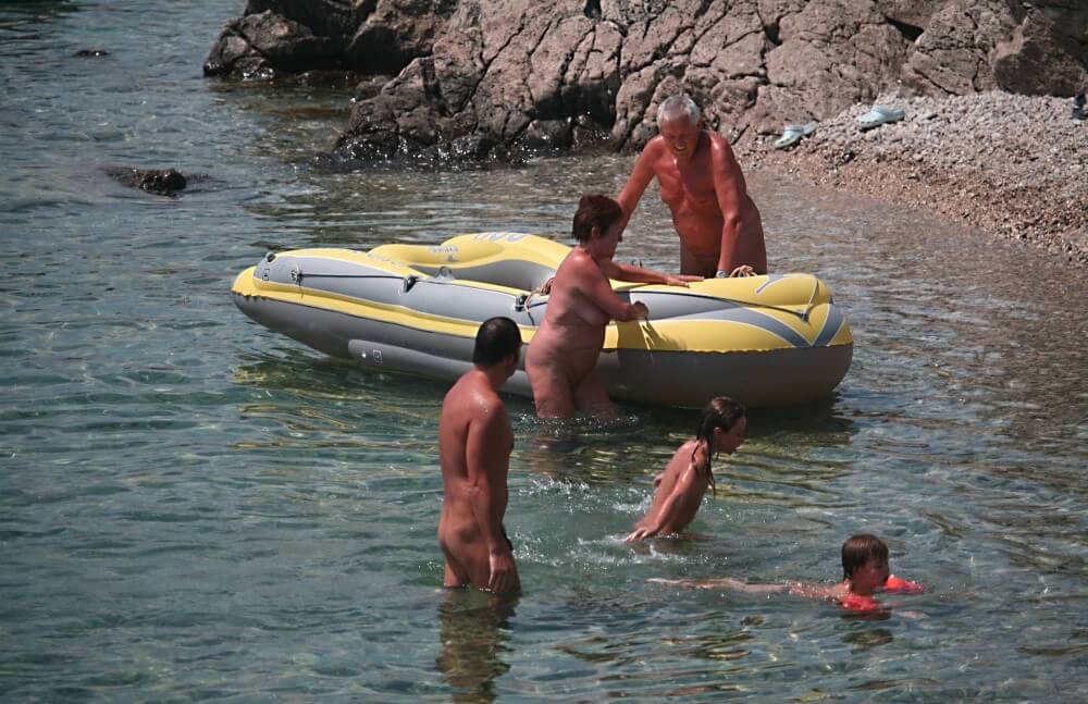Lone Nudist in Yellow Boat photos - Nudism is part of life