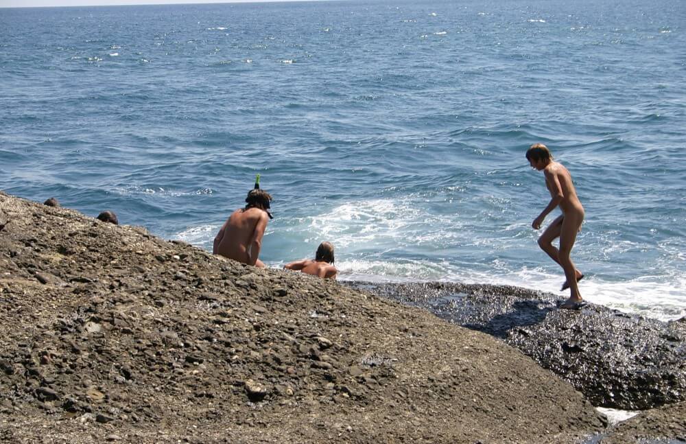 Leaning Against Hit Rocks pics - Nature is the best home for a naturist